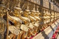 Garudas and nagas on external decorations of the Ubosoth, Wat Phra Kaew temple, Grand Palace, Bangkok, Thailand Royalty Free Stock Photo