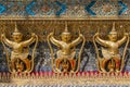 Garudas and nagas on external decorations of the Ubosoth, Wat Phra Kaew temple, Grand Palace, Bangkok, Thailand Royalty Free Stock Photo