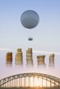 Gas Balloon, Stakes of Coins and Bridge Royalty Free Stock Photo