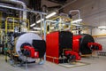 Gas boilers in gas boiler room for steam production Royalty Free Stock Photo