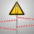 Gas bottle. Attention is dangerous. Warning sign. Safety technology. Triangular sign on the pillar and barrier tape