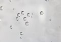 Gas bubbles of refreshing sparkling water attached to the glass on bright background with copy space Royalty Free Stock Photo