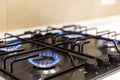 Gas burner on black modern kitchen stove Royalty Free Stock Photo