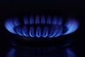 Gas burner with burning flame in darkness, closeup Royalty Free Stock Photo