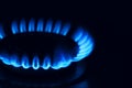 Gas burner with burning flame in darkness, closeup Royalty Free Stock Photo