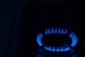 Gas burner with burning flame in darkness. Space for text Royalty Free Stock Photo