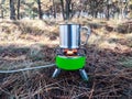 Gas burner or camping stove with metal cup Royalty Free Stock Photo