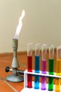 Gas burner with colored test tubes