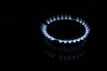 Gas-burner. Flame, close-up. Household gas, blue and red flame. Gas burner in the dark Royalty Free Stock Photo