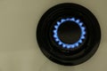 Gas burner of modern stove with burning blue flame, top view Royalty Free Stock Photo