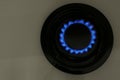 Gas burner of modern stove with burning blue flame, top view Royalty Free Stock Photo