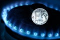 Gas burner and ruble coin, Russian money on home gas stove