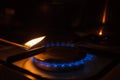 Gas burner on white modern kitchen stove. Kitchen gas cooker with burning fire propane gas. Royalty Free Stock Photo