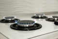 Gas burners with blue flame on modern stove Royalty Free Stock Photo