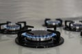 Gas burners with blue flame on stove Royalty Free Stock Photo