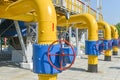 Red handle gate valve with steel pipe on gas compressor station Royalty Free Stock Photo