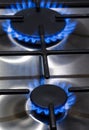 Gas Concepts. Closeup Macro Shoot of Two Gas Burners on Stove Surface with Fire Flames Royalty Free Stock Photo