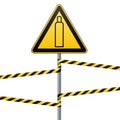 Gas cylinder. Attention is dangerous. Warning sign. Safety technology. Triangular sign on the pillar and barrier tape Royalty Free Stock Photo