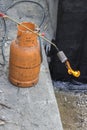 Gas cylinder with torch on flame