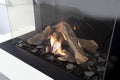 Gas fireplace with white mantel modern interior luxury design, close-up in a modern home Royalty Free Stock Photo
