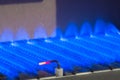Gas flame inside of the gas boiler Royalty Free Stock Photo