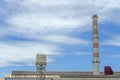 Gas flares in petroleum refinery  with blue sky background Royalty Free Stock Photo