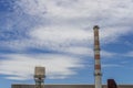 Gas flares in petroleum refinery  with blue sky background Royalty Free Stock Photo