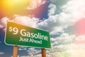 $9 Gas Green Road Sign Against Cloudy Sky Royalty Free Stock Photo