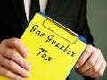 Gas Guzzler Tax sign on the piece of paper