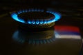Gas at home for cooking. Natural gas also called fossil gas and Russian flag reflection. Nord Stream is a natural gas pipeline Royalty Free Stock Photo
