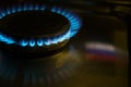 Gas at home for cooking. Natural gas also called fossil gas and Russian flag reflection. Nord Stream is a natural gas pipeline Royalty Free Stock Photo