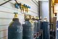 Gas industry, oxygen cylinders and pipes with valves Royalty Free Stock Photo