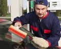 Gas Jockey Cleaning Windshield