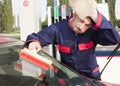 Gas Jockey Cleaning Windshield Royalty Free Stock Photo