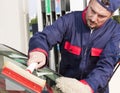 Gas Jockey Cleaning Windshield