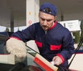 Gas Jockey Cleaning Windshield Royalty Free Stock Photo