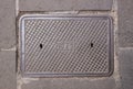 A gas manhole cover on an asphalt road in the city Royalty Free Stock Photo