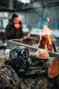 Gas mask against fire, stalker eats on background Royalty Free Stock Photo