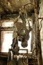 Gas Masks are hung up on a pole in an abandoned building in Pripyat, Ukraine, site of the 1986 Chernobyl nuclear desaster Royalty Free Stock Photo