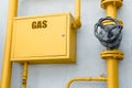 Gas meter box and pipes near grey wall outdoors Royalty Free Stock Photo