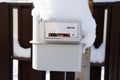 The gas meter is covered with snow and frost Royalty Free Stock Photo