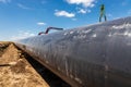 Gas and oil pipeline construction. Pipes welded together. Big pipeline is under construction. Cloudy sky Royalty Free Stock Photo