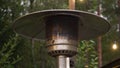 Gas outdoor heater working on terrace. Steel metal warmer. Royalty Free Stock Photo