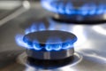 Gas Oven Concepts. Macro Shoot of Two Gas Burners on Stove Surface with Flames Royalty Free Stock Photo