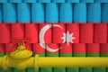 Gas pipe and barrels with petrochemicals with flag of Azerbaijan. Petroleum industry related 3d rendering