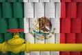 Many barrels with petrochemicals with flag of Mexico and gas pipe. 3d rendering