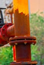 Gas pipe half covered with rust