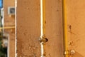 Gas pipe hanging on the wall of a building Royalty Free Stock Photo