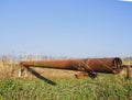 Gas pipeline through irrigation canal in a protective steel pipe Royalty Free Stock Photo