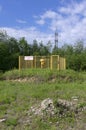 Gas pipeline section behind a yellow grid with a sign in Russian `flammable gas!`